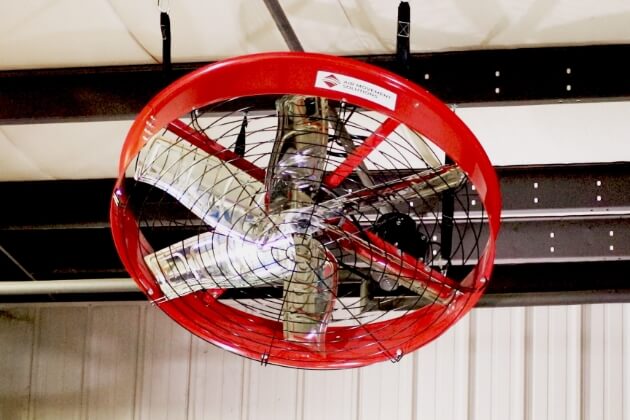 AirFocus industrial big fan hanging at angle from garage ceiling